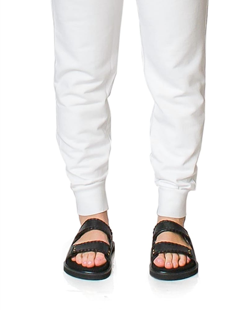 Front of a model wearing a size L Tennis Club Logo Sweatpants in White in White by The Academy New York. | dia_product_style_image_id:339877